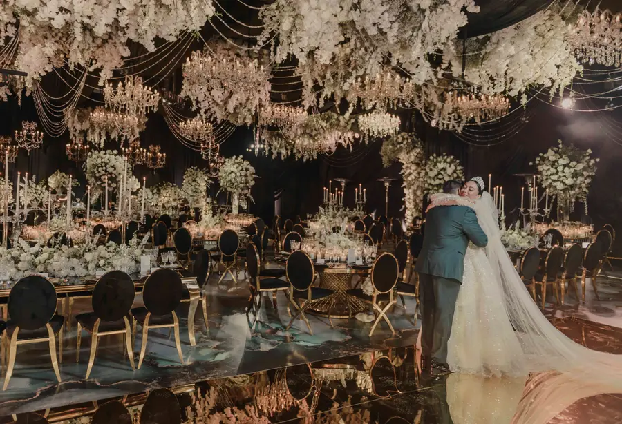 Destination wedding reception illuminated at night