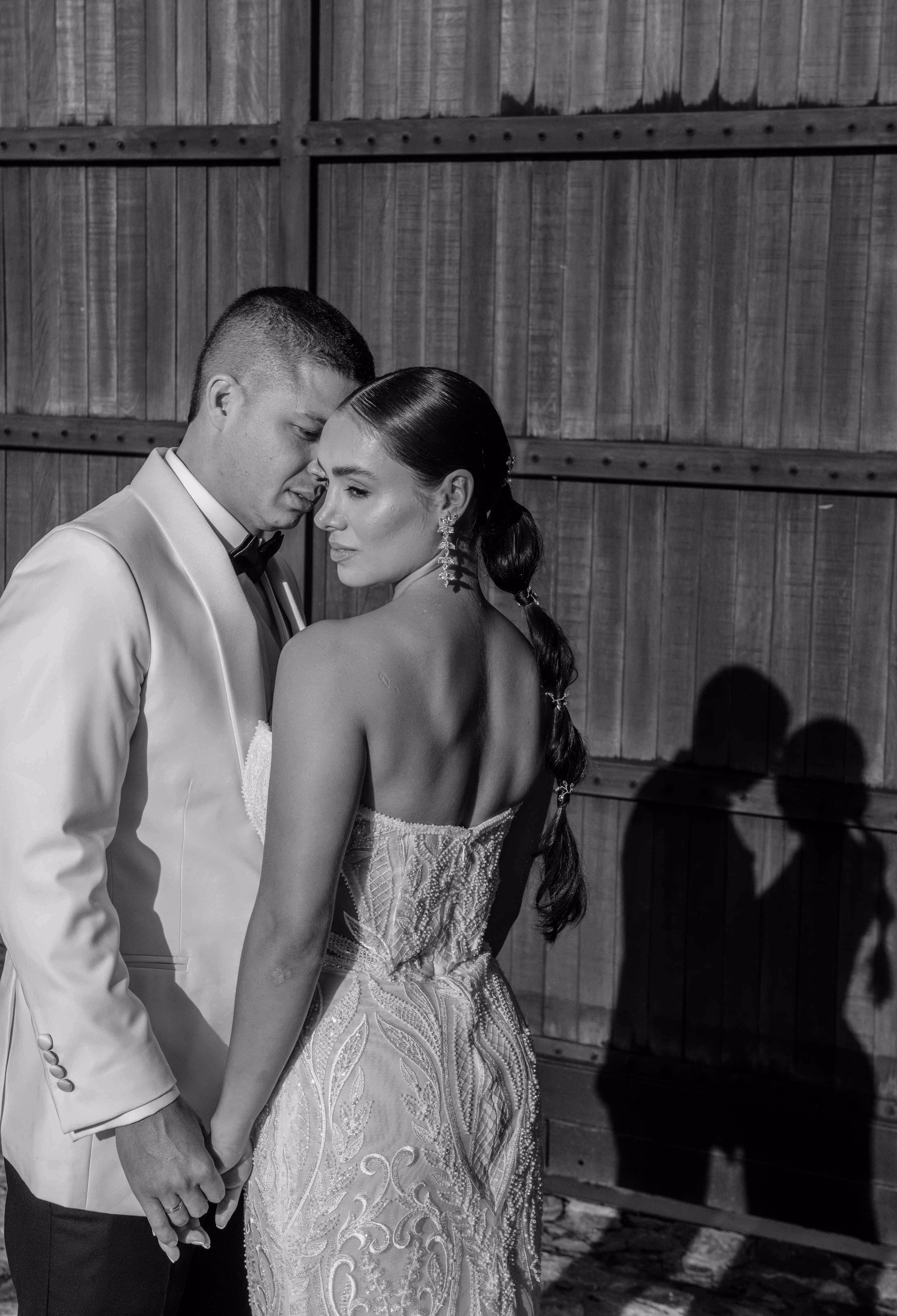 Black-and-white editorial portrait of newlyweds