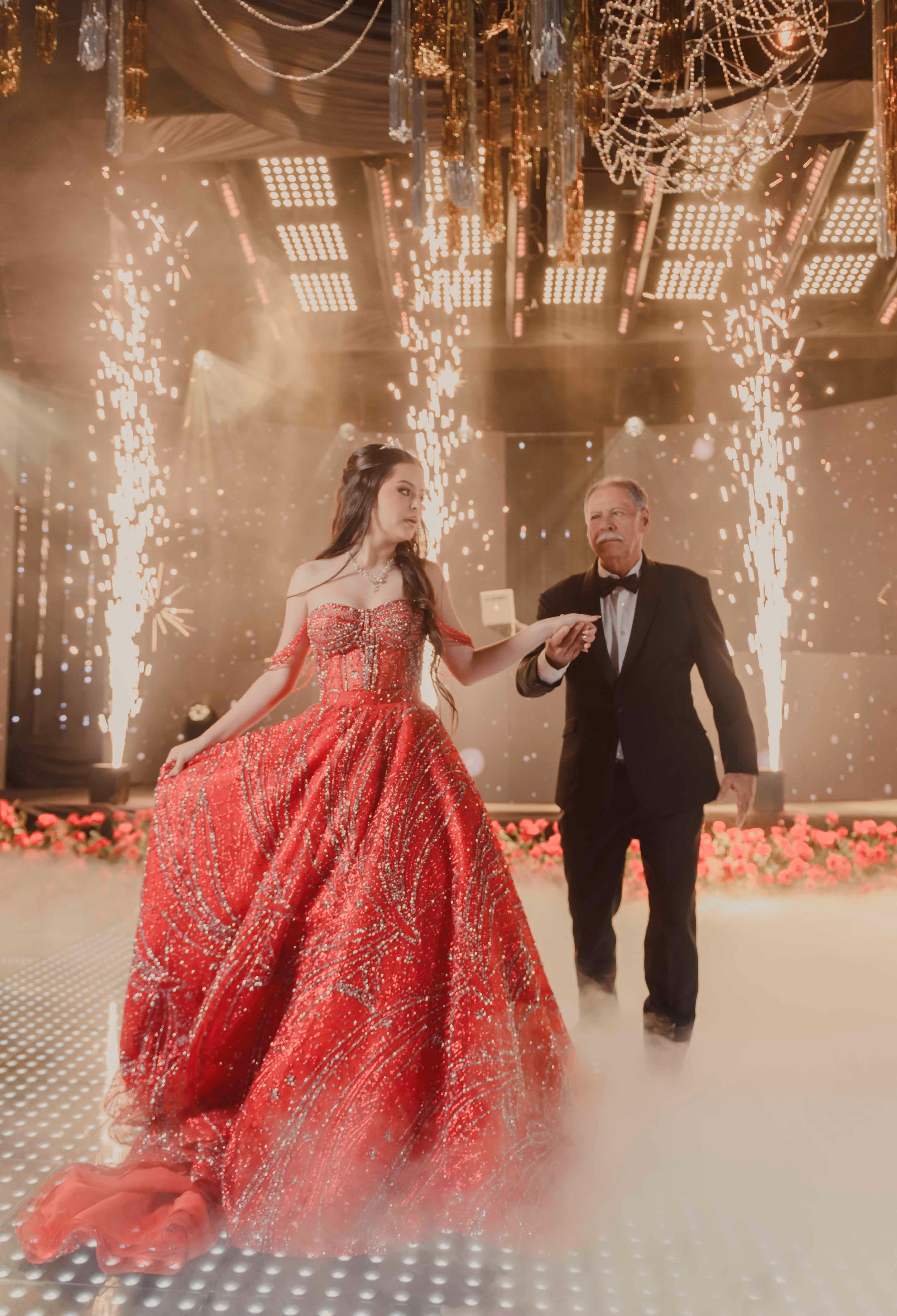Quinceañera entering her celebration with her father