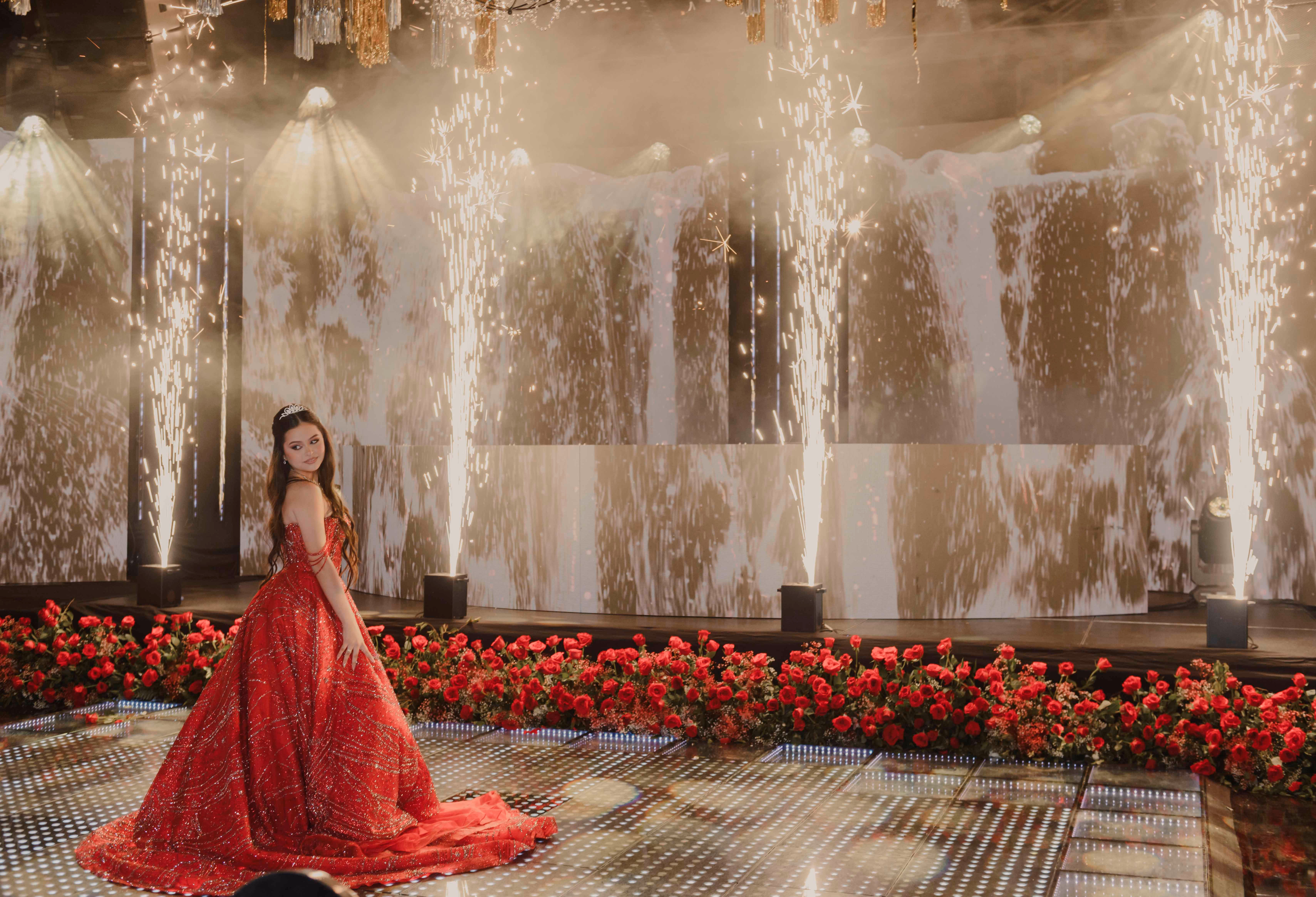 Quinceañera in a red gown during her celebration in Medellín
