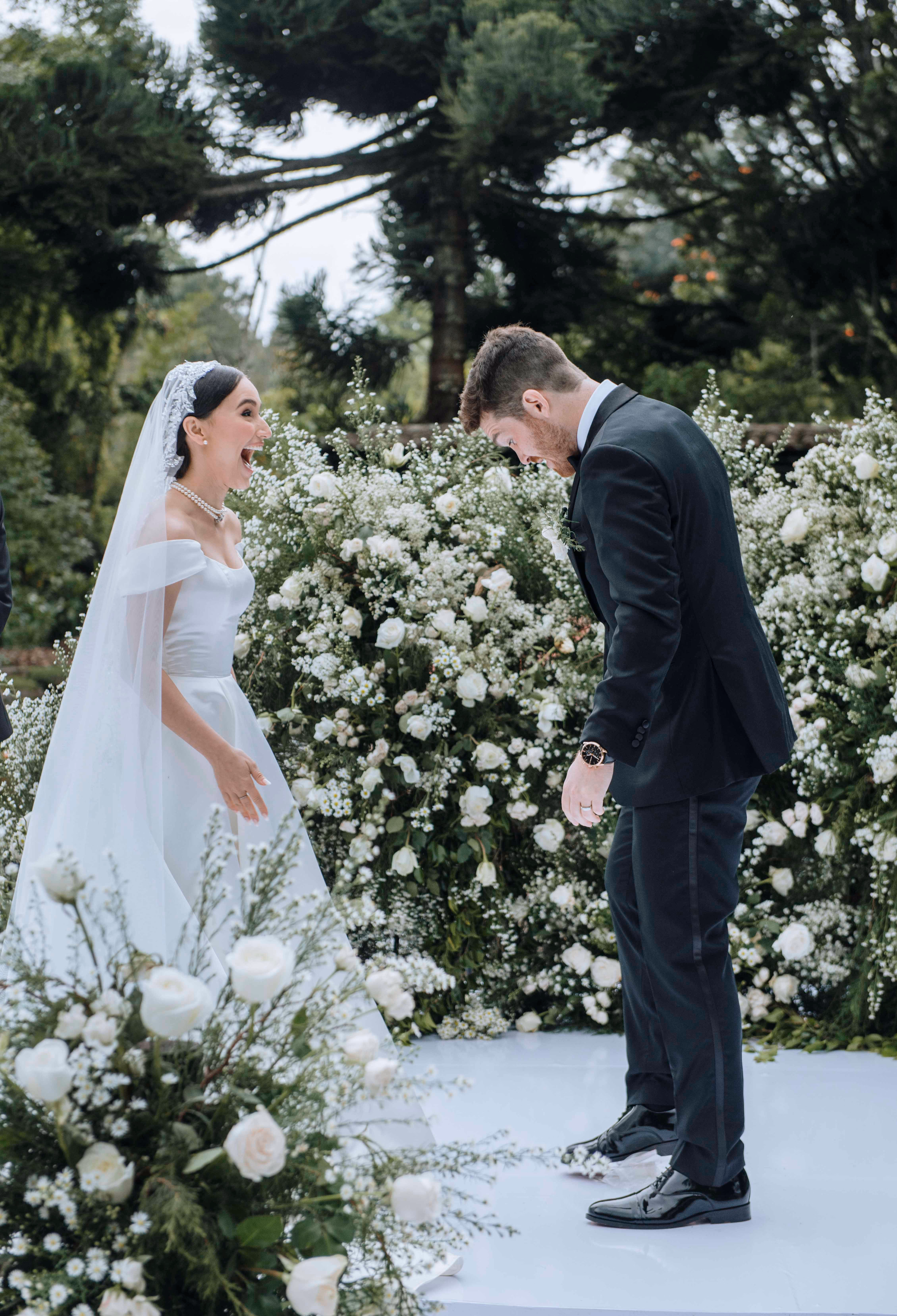 Newlyweds during an elegant wedding ceremony surrounded by guests
