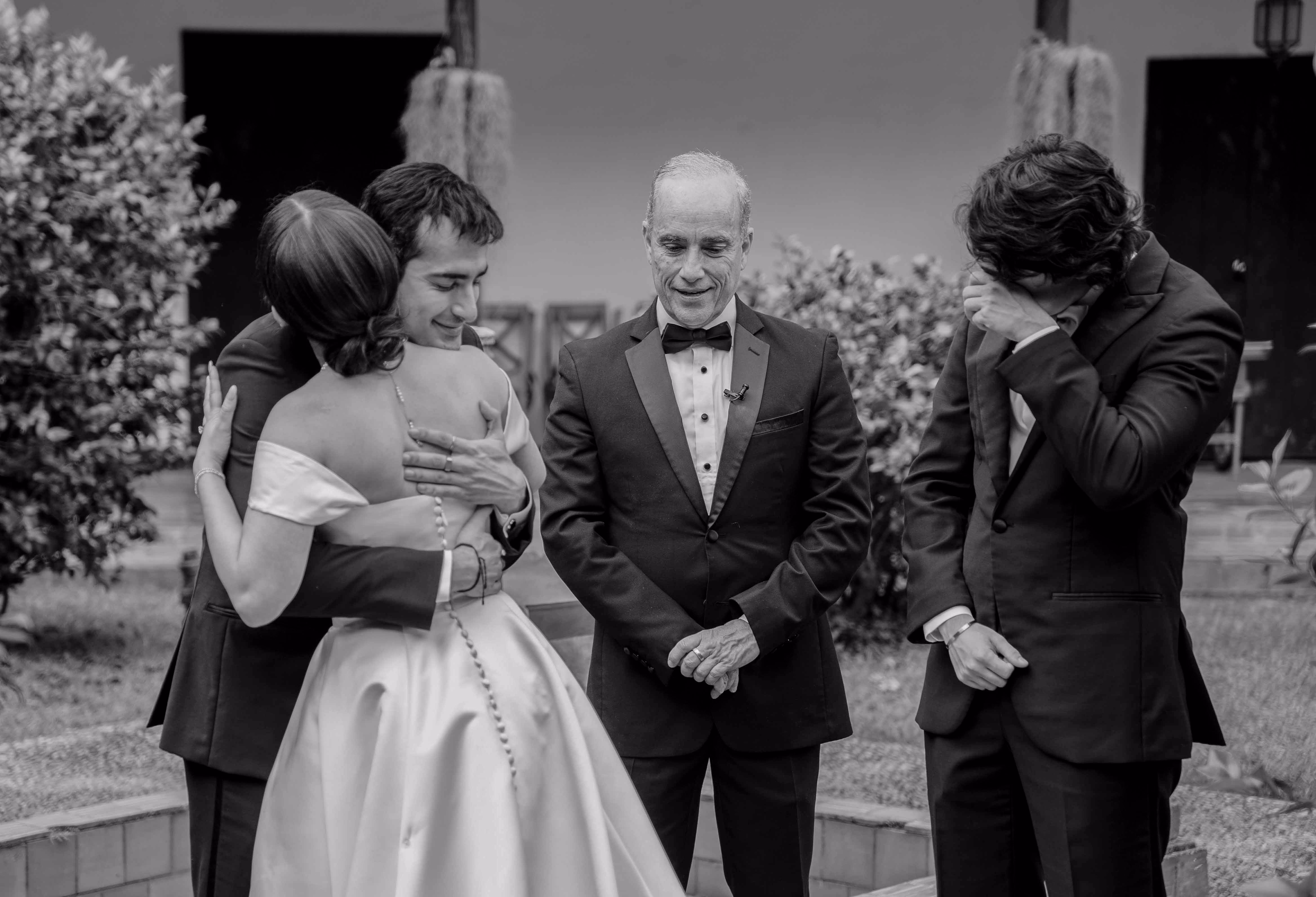 Family embrace during a wedding ceremony
