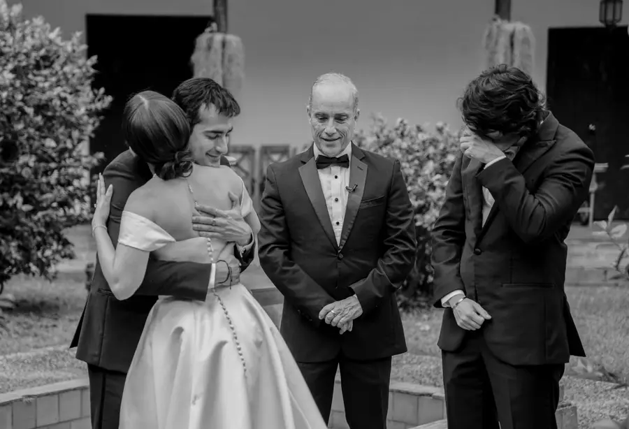Family embrace during a wedding ceremony